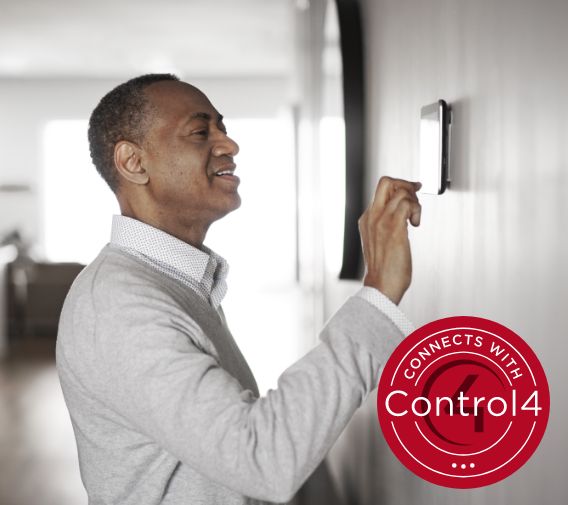 guy ajusting thermostat