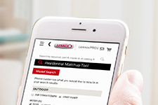 HVAC tech using residential matchup tool on mobile device.