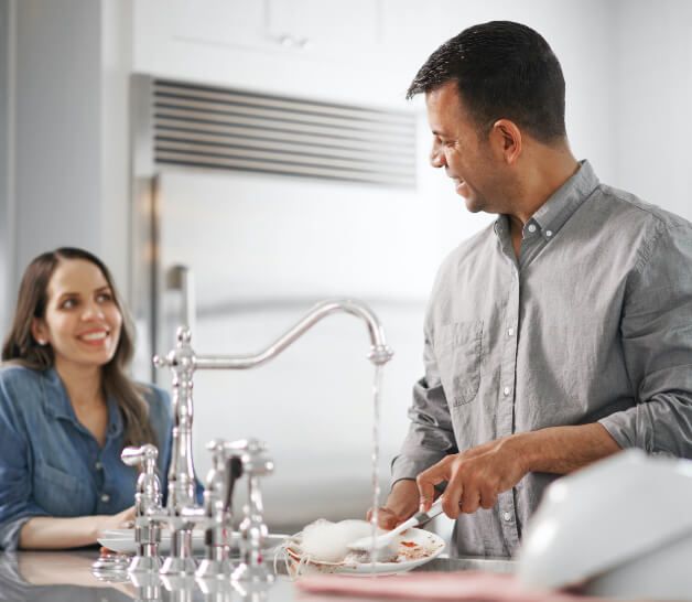 man and woman in kitchen