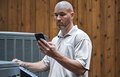 HVAC technician checking the Lennox serial number lookup results