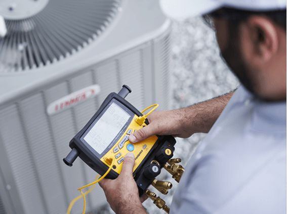 HVAC technician working on equipment