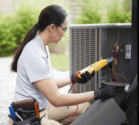 Technician servicing an HVAC system