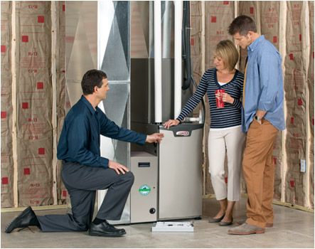 Homeowners with their new furnace