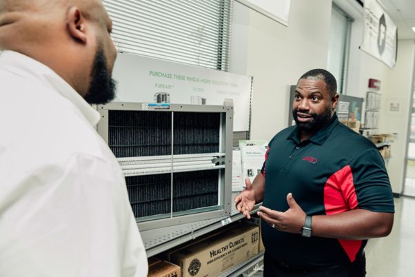 Lennox Stores personnel assisting an HVAC professional