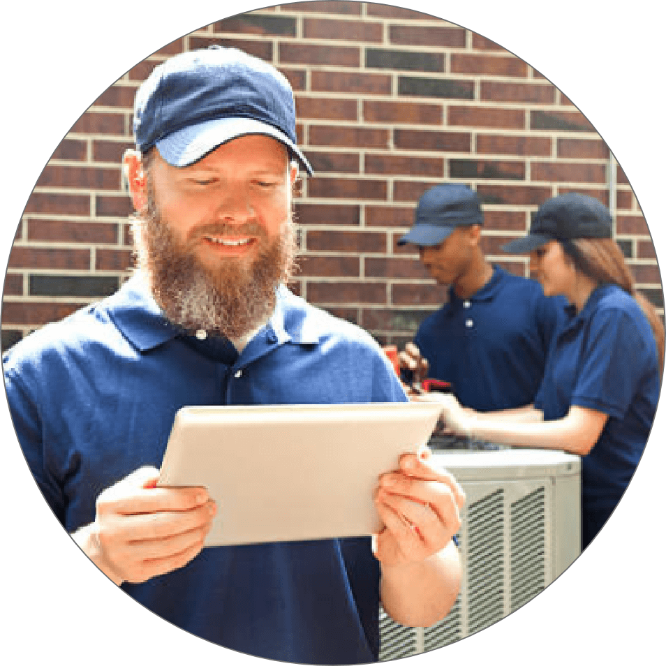 HVAC technician accessing load calculator reports in the field.